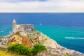 Chiesa San Pietro catholic church, Lord Byron Parque Natural park De Portovenere town on stone cliff rock, yachts on turquoise wat Royalty Free Stock Photo