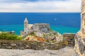 Chiesa San Pietro church, Lord Byron Parque Natural park De Portovenere town on stone cliff rock and blue sky, view from Doria cas Royalty Free Stock Photo