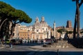 Chiesa Santa Maria di Loreto and Rome visitors passing by in a sunny winter day, Rome, Italy