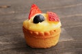 Chiffon/cream cake basket with fruits on the wooden background Royalty Free Stock Photo