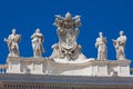 Chigi coats of arms and the statues of saints that crown the colonnades of St. Peter Square built on 1667 on the