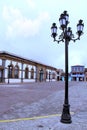 Chignahuapan Puebla, Mexico - Sep 7 2014: Plaza de Armas with a colorful wooden kiosk and the Parroquia de Santiago Apostol church