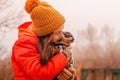 A little girl of 10-11 years old in an orange jacket with her pet Chihuahua dog and teen Royalty Free Stock Photo