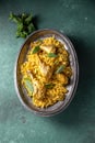 Chiken biryani Rice with yogur and mint on metal, top view. Pakistani and indian dish Royalty Free Stock Photo