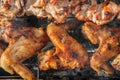 Chiken wings and Juicy roasted kebabs and on the BBQ Royalty Free Stock Photo