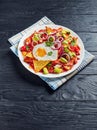 Chilaquiles with a fried egg on a plate Royalty Free Stock Photo