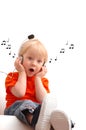 Child of 2 years listening music Royalty Free Stock Photo