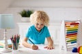 Child with abacus doing homework after school. Royalty Free Stock Photo