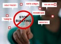 Child abused bullying concept. A boy pointing at a sign Stop bullying. Child problems at school. Royalty Free Stock Photo