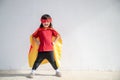 Child acts like a superhero to save the world Royalty Free Stock Photo