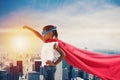 Child acts like a superhero to save the world Royalty Free Stock Photo