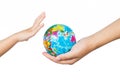 Child and Adult Holding a World Globe in Hands Royalty Free Stock Photo