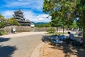 Child and adult painting Matsumoto castle on sunny day