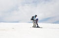 Child and an adult in warm overalls, skiing Royalty Free Stock Photo