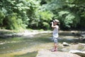 Child adventures in a mountain stream Royalty Free Stock Photo