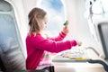 Child in airplane. Fly with family. Kids travel. Royalty Free Stock Photo