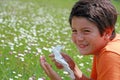 Child with an allergy to pollen while sneeze in the middle of th Royalty Free Stock Photo