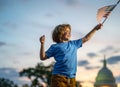 Child with American flag in Washington DC, capitol, congress building. American people celebrate 4th of July. American Royalty Free Stock Photo