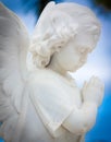 Child angel statue with a sky background Royalty Free Stock Photo