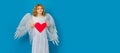 Child with angel wings hold paper heart. Symbol love and valentines day. Valentines day banner. Cute child with angel Royalty Free Stock Photo