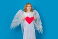 Child with angel wings hold paper heart. Symbol love and valentines day. Valentines day banner. Cute child with angel Royalty Free Stock Photo