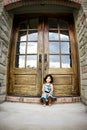 Child and antique door