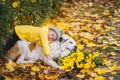 Child with apple having rest next to big dog