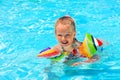Child with armbands in swimming pool Royalty Free Stock Photo