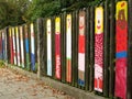 Child art paintings on wooden fence