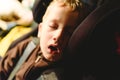 Child asleep in his extenuated car seat