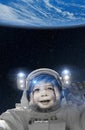 Child astronaut waving at Earth from space