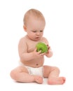 Child baby boy sitting with green apple Royalty Free Stock Photo