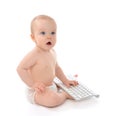 Child baby boy toddler sitting with hands typing on the remote w Royalty Free Stock Photo