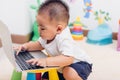 Child baby boy working using laptop computer Royalty Free Stock Photo