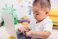 Child baby boy working using laptop computer Royalty Free Stock Photo