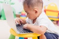 Child baby boy working using laptop computer Royalty Free Stock Photo