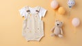 child baby clothes, toy teddy bear and balloons on pastel background