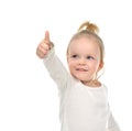 Child baby girl happy looking up smiling with hand thumb up sign Royalty Free Stock Photo