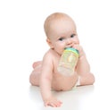 Child baby girl lying happy holding breastfeeding bottle nipple Royalty Free Stock Photo