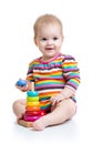 Child baby playing with color pyramid toy Royalty Free Stock Photo