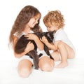 Child and baby playing with Maine Coon kitten Royalty Free Stock Photo