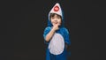 Child with baby shark costume