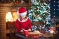 Child baking Christmas cookies. Kids bake for Xmas