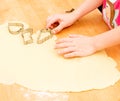 Child baking cookies in christmas time