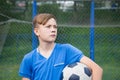 Child with ball playing football