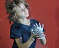 Child with a ball of powder magnesia chalk