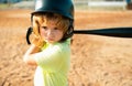 Child baseball player focused ready to bat. Kid holding a baseball bat. Royalty Free Stock Photo