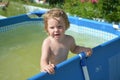 A child bathes in a children`s pool Royalty Free Stock Photo