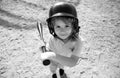 Child batter about to hit a pitch during a baseball game. Kid baseball ready to bat. Royalty Free Stock Photo