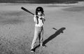 Child batter about to hit a pitch during a baseball game. Kid baseball ready to bat. Royalty Free Stock Photo